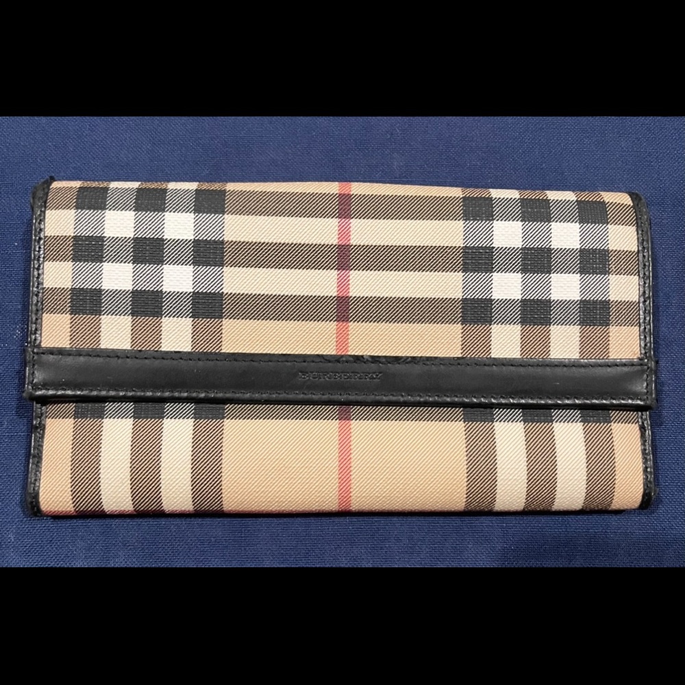 Authentic Burberry wallet.  Used, normal wear.